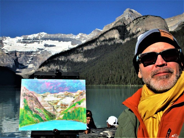 Michael Strangelove painting
        outdoors at Lake Louise